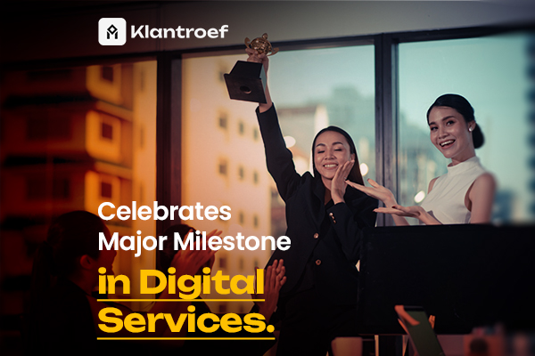 Two women celebrating on stage with a trophy, marking a major achievement in digital service excellence.