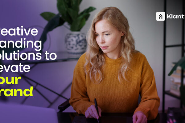 Woman working on creative branding strategies at desk with stylus and laptop in modern home office.