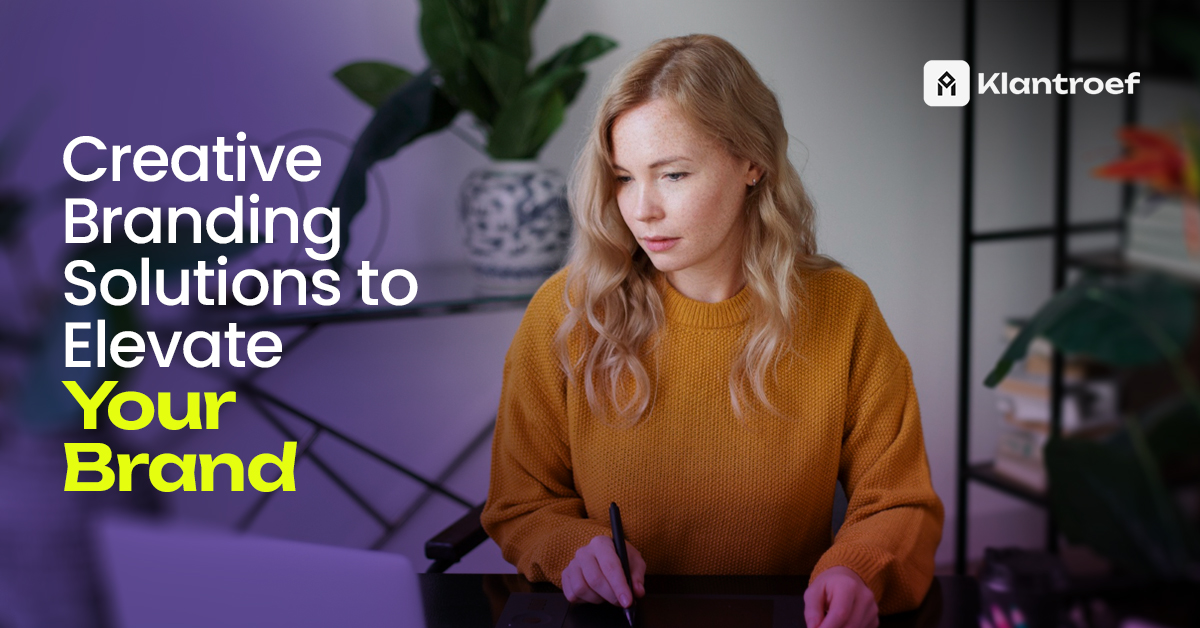Woman working on creative branding strategies at desk with stylus and laptop in modern home office.