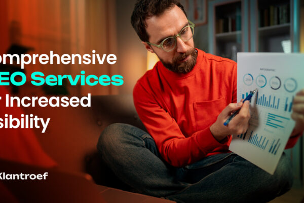 A man in glasses and a red sweatshirt analyzes SEO performance charts, emphasizing data-driven visibility improvements.