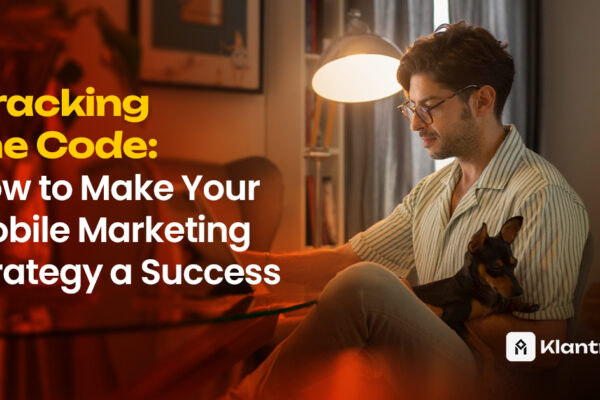 A man working on his laptop in a cozy room, holding a small dog on his lap, representing focused work-from-home mobile marketing strategy planning.