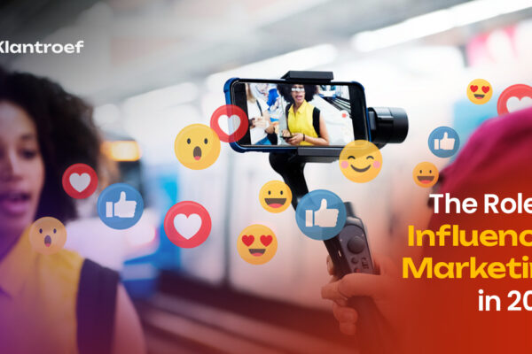 A content creator is being filmed on a smartphone mounted on a gimbal, surrounded by floating social media reaction icons, with the text "The Role of Influencer Marketing in 2025" and Klantroef branding.