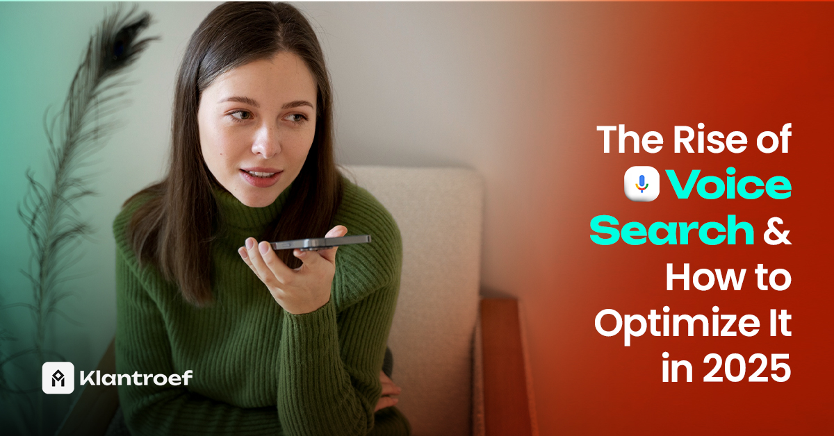 A woman in a green sweater uses voice command on her phone, representing the growing trend of voice search in 2025.