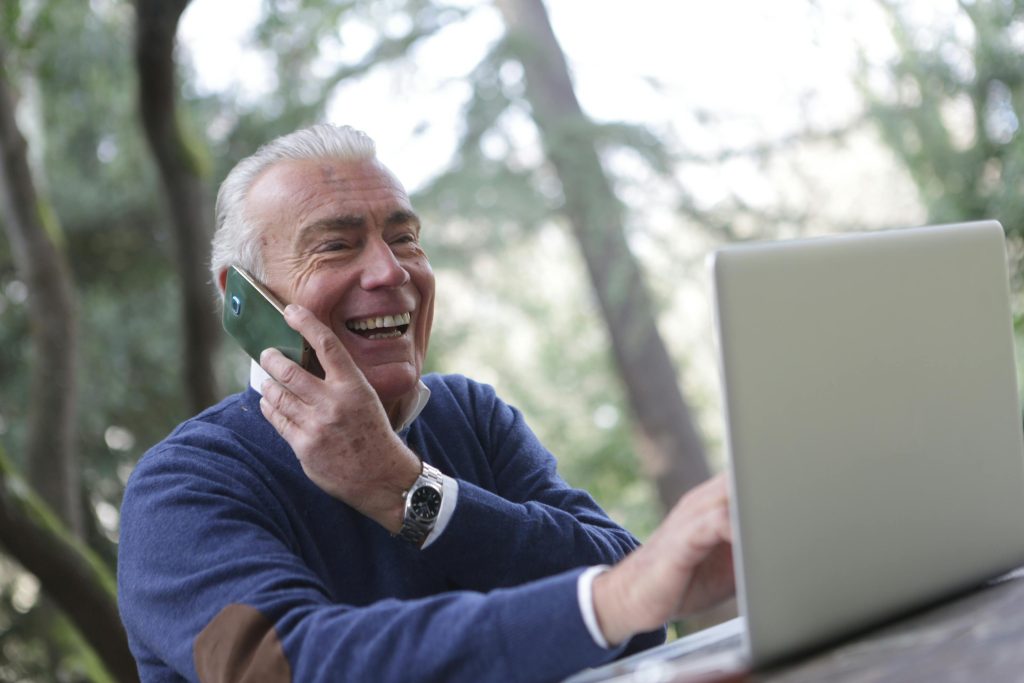 A person using voice search on a smartphone, representing optimization for 2025 trends